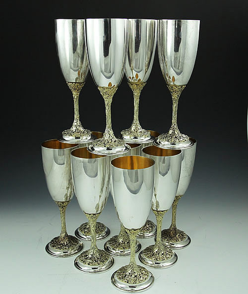 Asprey sterling champagne flutes in chased and pierced vine pattern