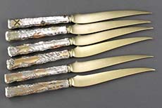 Tiffany sterling knives with gold and niello inlay