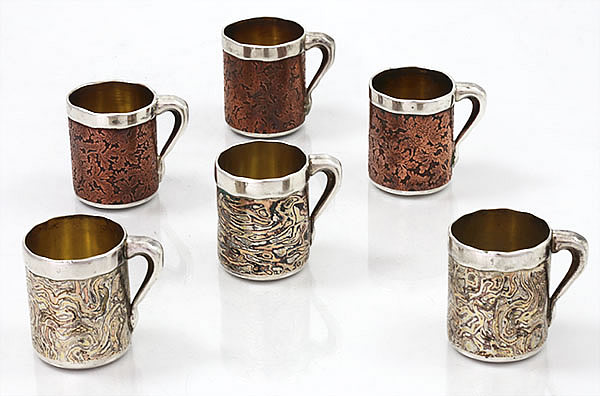 rare set of six cups by Tiffany and company circa 1880 with mokume and etrched copper decoration