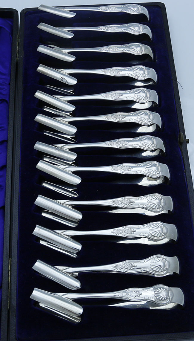Set of twelve English hallmarked silver individual asparagus servers in original box