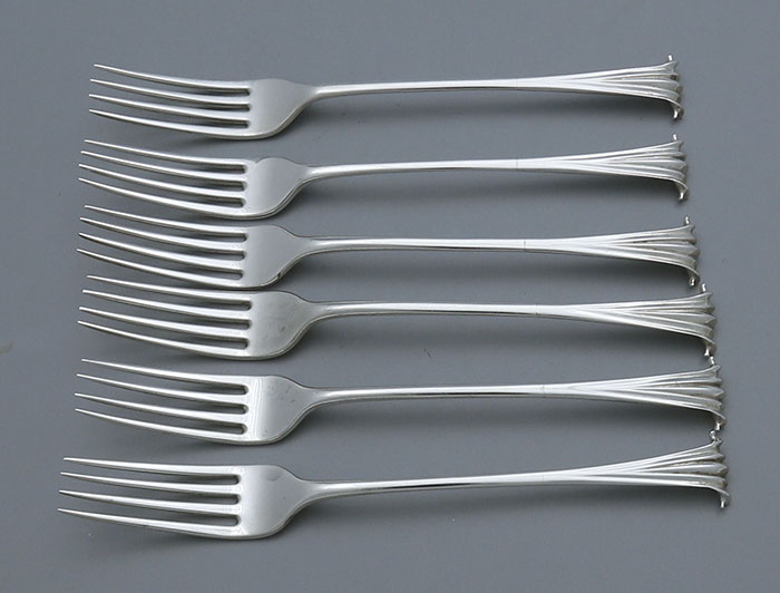 Six matching Onslow pattern Georgian silver dinner forks dated London 1803