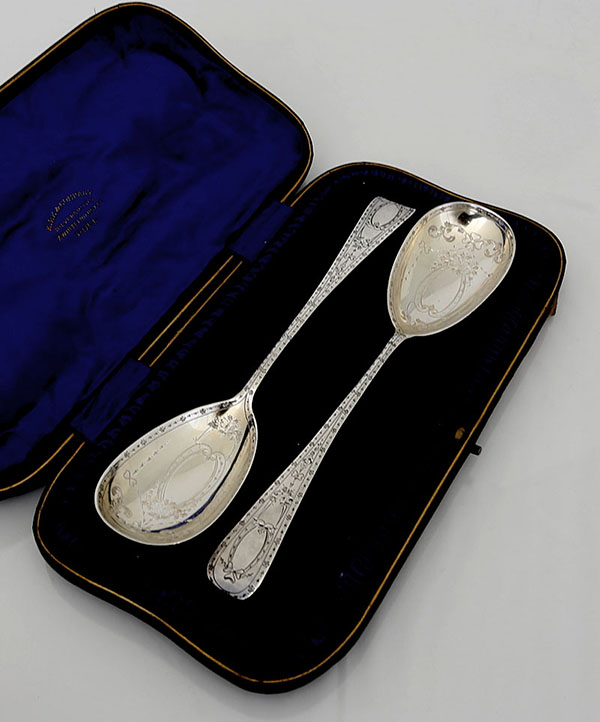 Pair English silver engraved berry spoons in box