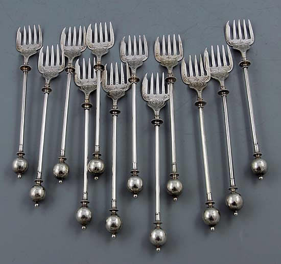 Set of twelve antique silver cocktail forks by George Sharp with ball terminals