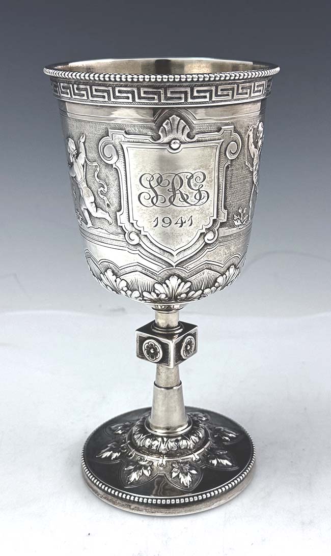 antique American coin silver goblet with chased dancing cherubs