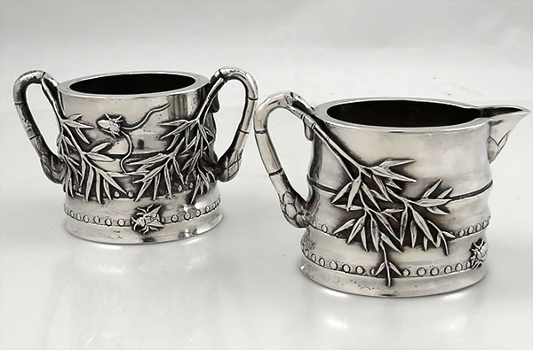 Chinese silver sugar and creamer with applied bamboo and bugs by Luen Wo