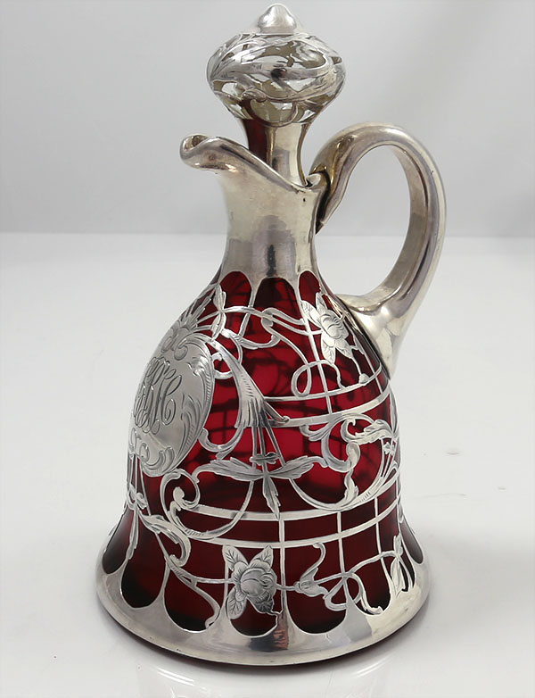 Cranberry glass and silver overlay decanter with stopper