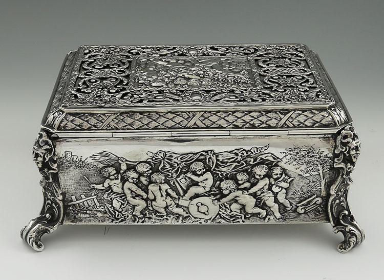 Large German 800 silver table box with chased cherubs and scenes