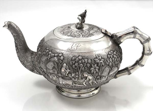 Indian silver teapot with hand chase scenes