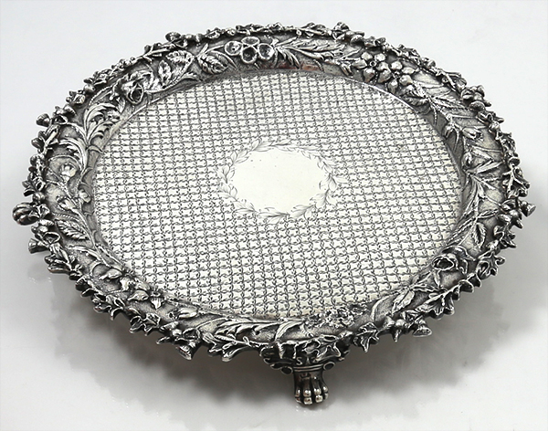 antique Kirk sterling silver salver with diapered decoration and chased floral border