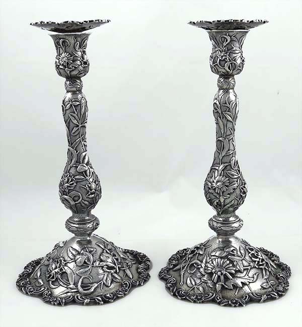 pair of fine antique Kirk and Son antique sterling candlesticks with chased flowers and vines