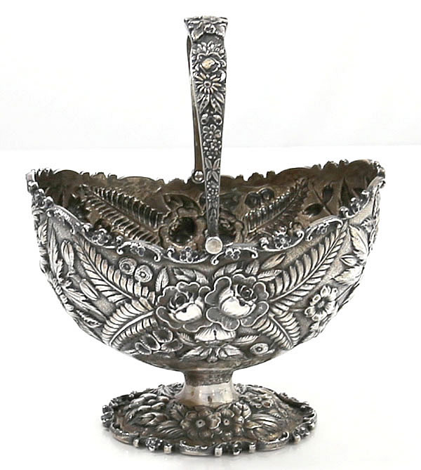 Kirk repousse sterling sugar basket with swing handle