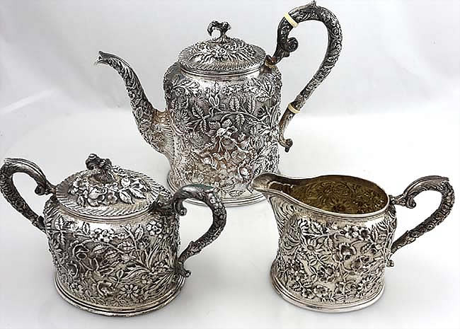 Schofield repousse antique sterling three piece teaset with chased chrysanthemums