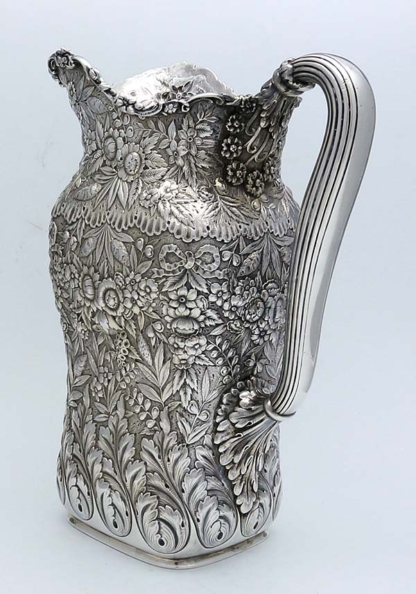 Tiffany antique sterling silver pitcher hand chased