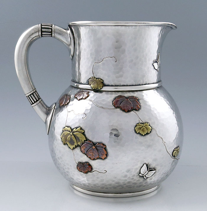 Tiffany antique sterling and mixed metals water pitcher hammered and applied