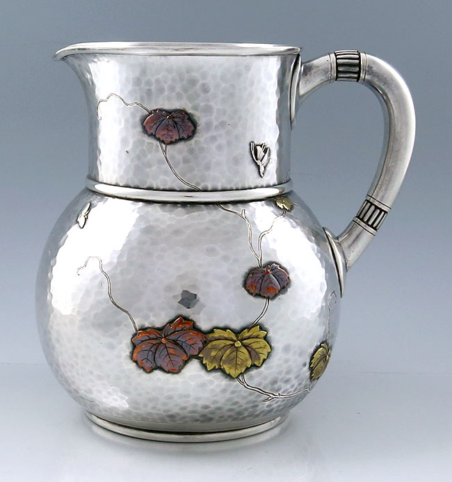 Tiffany antique sterling and mixed metals water pitcher hammered and applied