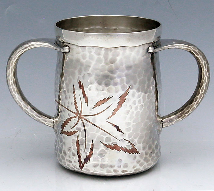 Tiffany antique sterling hammered two handle cup with mixed metal copper inlay