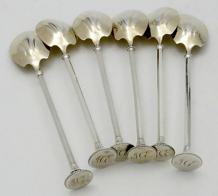 six matching seal top coin silver spoons
