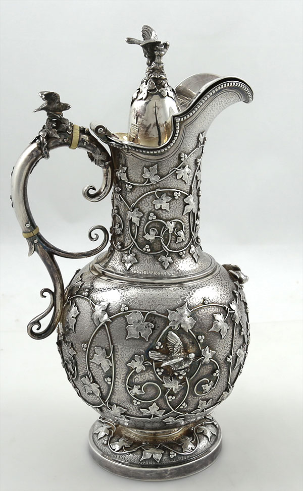 Fine antique silver chocolate pot by Tiffany and Company with applied cast vines and ivy with birds