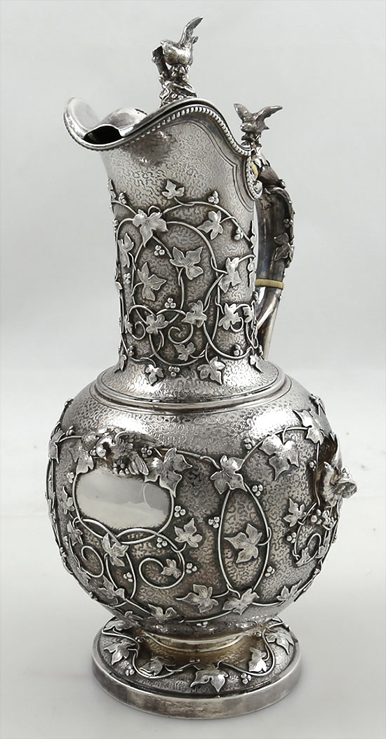 Fine antique silver chocolate pot by Tiffany and Company with applied cast vines and ivy with birds