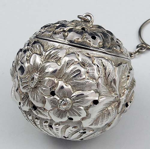 repousse antique sterling silver tea ball with gilded interior