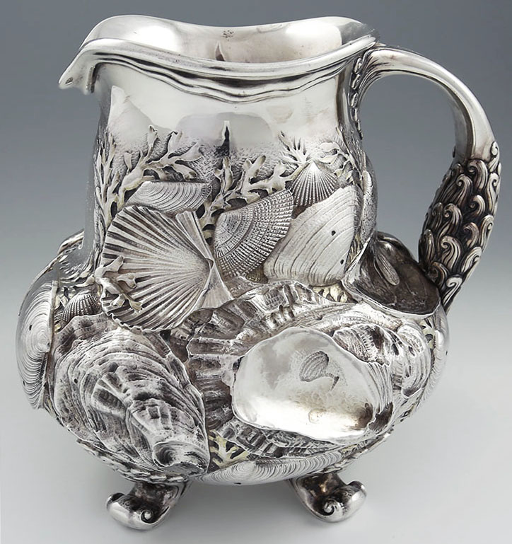 Rare Whiting antique sterling silver pitcher with chased three dimensional shells and ornate handle