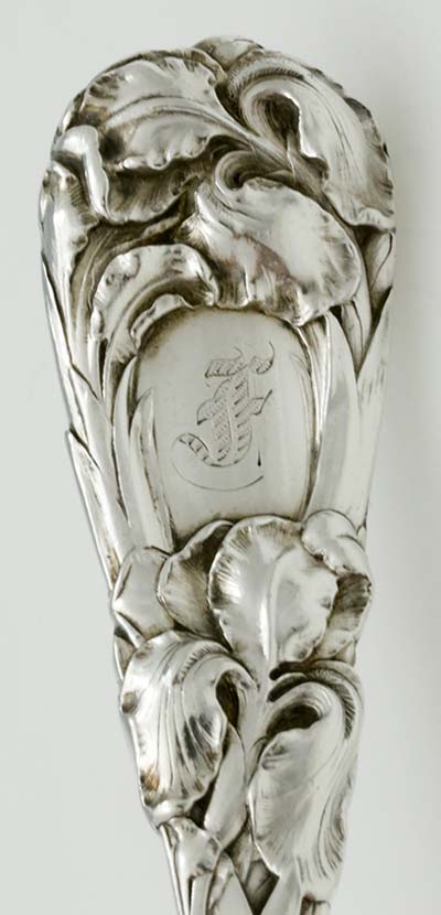 detail of handle of Durgin New Art salad set with F monogram