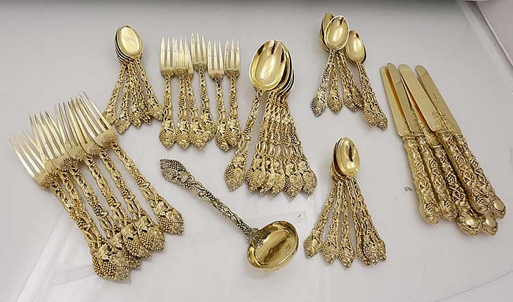 43 piece set of chased and pierced vine silver gilt flatware