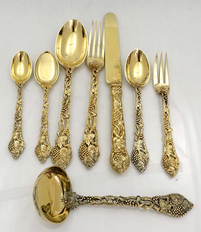one of each piece chased and pierced vine silver gilt flatware Francis Higgins London 1910