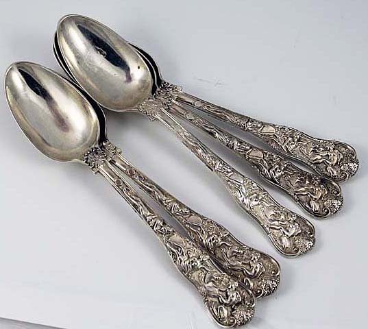English silver dessert spoons in the Bacchanalian pattern