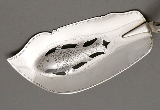 detail of blade on Exeter silver fish slice with pierced embossed fish