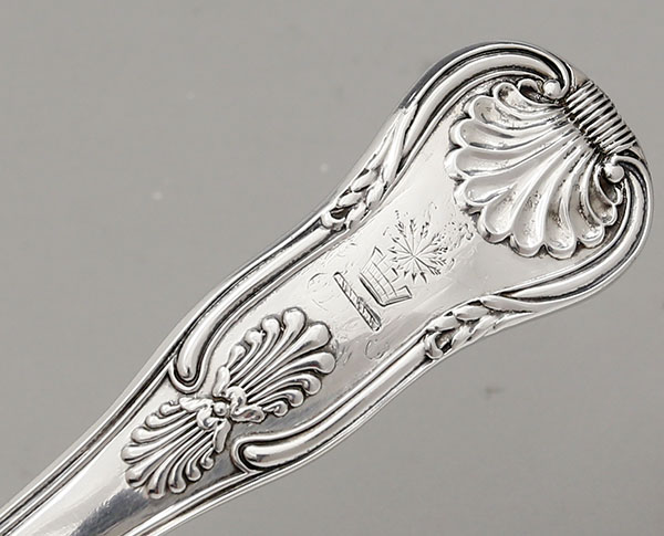 engraved crest on monogram removal on English silver stuffing spoon