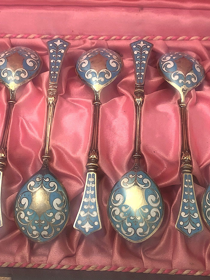 enamel and silver spoons in box