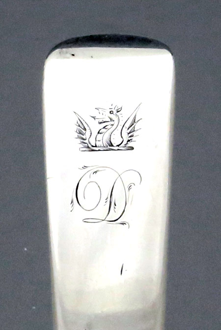 crest and mono on Irish silver stuffing spoon