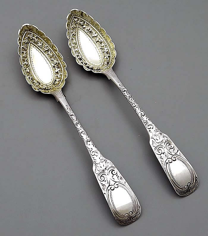 Irish silver antique berry spoons with later chased bowls and handles