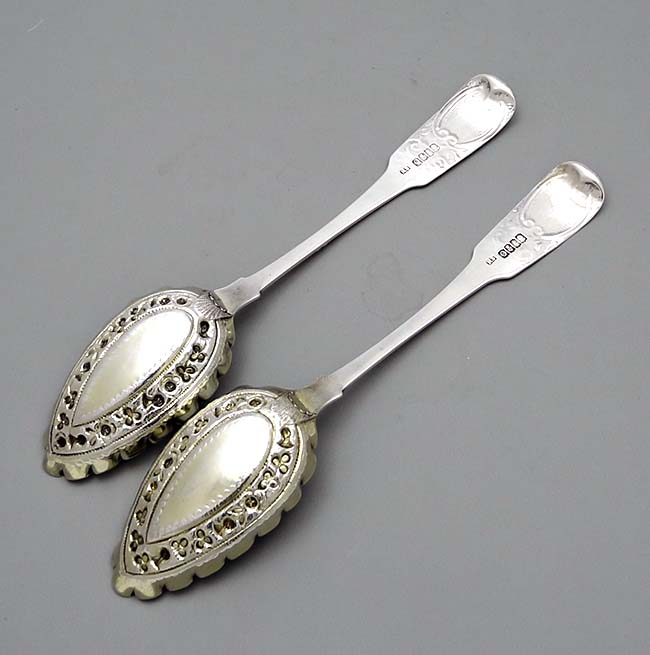 Irish silver antique berry spoons with later chased bowls and handles