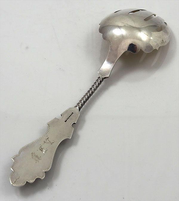 Duhme coin silver serving fork with applied rams head