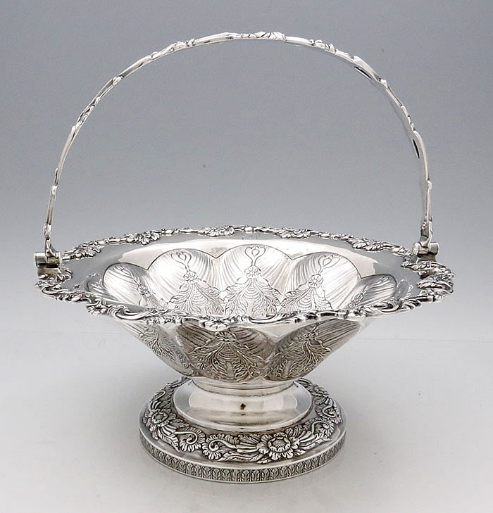 one of pair of A E Warner coin silver baskets