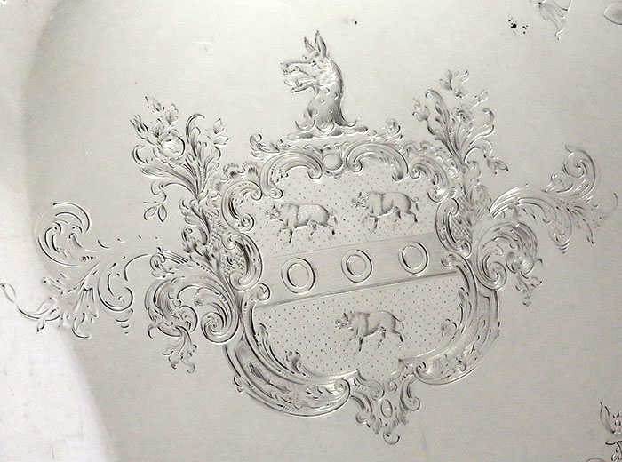 detail of crest on oval antique silver coin tray
