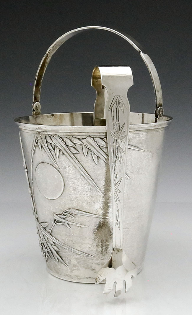 Chinese silver ice bucket with swing handle and ice tongs by Hung Chong