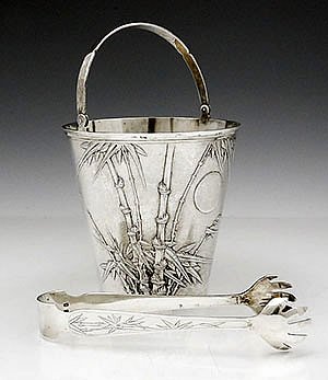 Chinese silver ice bucket with matching tongs by Hung Chong chased with bamboo