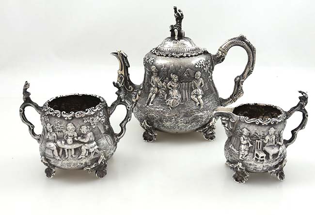 Frederick Elkington English silver three piece figural tea set 