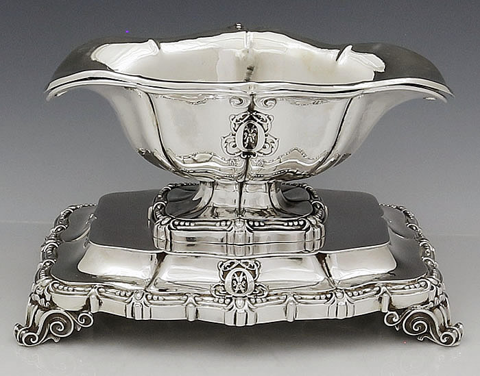 French silver antique sauceboat with handle on stand