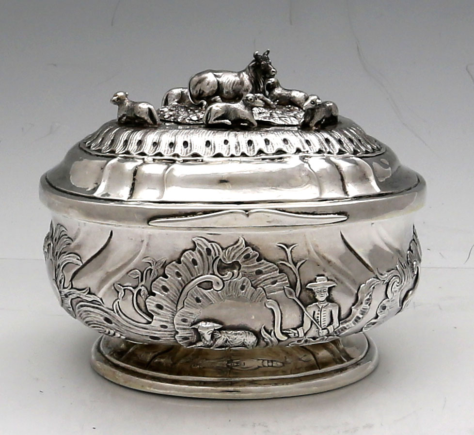 Konigsberg antique silver oval sugar box with applied sheel and chased pastotal scene circa 1800