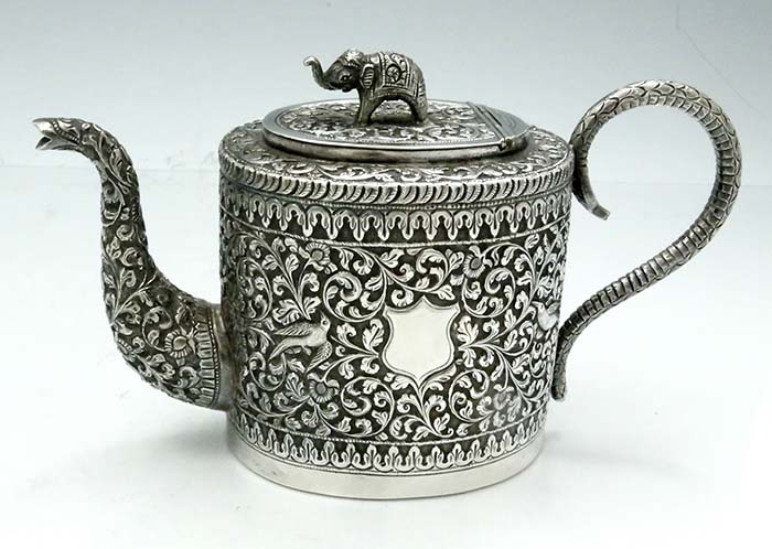 antique Indian Kutch region teapot with elephant finial chased birds