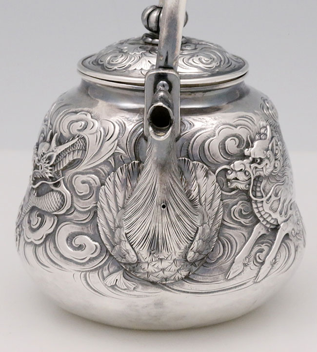 Spout of Japanese silver teapot with feathers