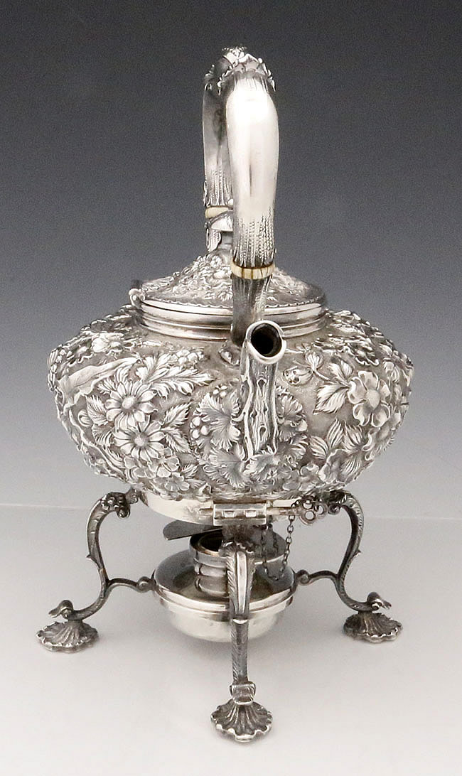 Jenkins and Jenkins sterling silver repousse ketytle on stand