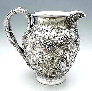 S Kirk & Son Co antique sterling chased pitcher floral repousse