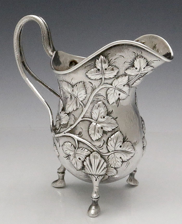 Kirk 11 ounce antique silver footed creamer