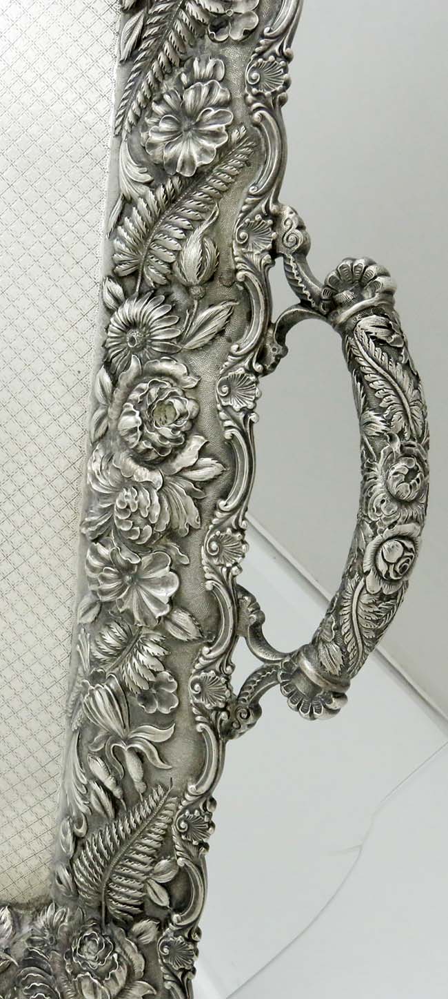 detail of the handle of Schultz Baltimore silver tray