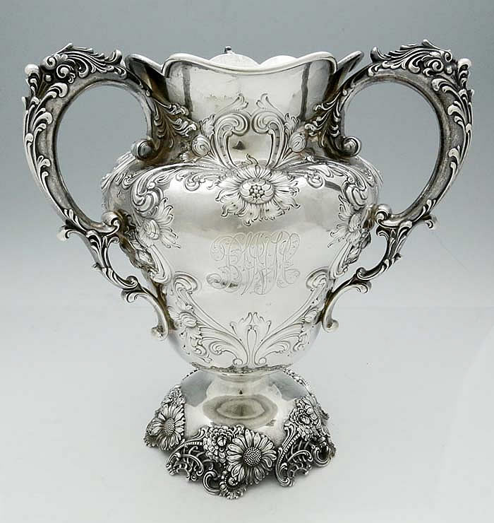 Antique sterling silver three handle ornate locing cup